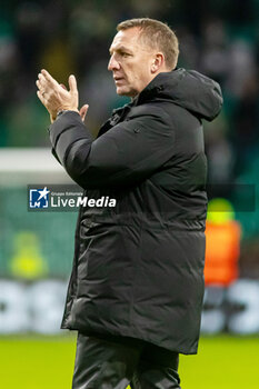 2023-12-13 - Celtic FC Manager, Brendan Rogers applauds the fans following his sides victory during the UEFA Champions League, Group E football match between Celtic FC and Feyenoord on December 13, 2023 at Celtic Park in Glasgow, Scotland - FOOTBALL - CHAMPIONS LEAGUE - CELTIC V FEYENOORD - UEFA CHAMPIONS LEAGUE - SOCCER