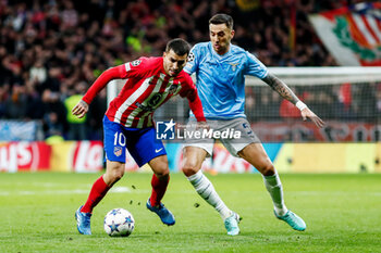 2023-12-13 - Jose Maria Gimenez of Atletico de Madrid and Matias Vecino of SS Lazio during the UEFA Champions League, Group E football match between Atletico de Madrid and SS Lazio on December 13, 2023 at Civitas Metropolitano stadium in Madrid, Spain - FOOTBALL - CHAMPIONS LEAGUE - ATLETICO MADRID V LAZIO - UEFA CHAMPIONS LEAGUE - SOCCER