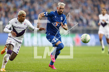 2023-04-13 - Domilson Cordeiro dos Santos Dodo of Fiorentina Kristoffer Velde of Lech during the UEFA Europa Conference League, Quarter-finals, 1st leg football match between KKS Lech Poznan and ACF Fiorentina on April 13, 2023 at INEA Stadion in Poznan, Poland - FOOTBALL - CONFERENCE LEAGUE - LECH POZNAN V FIORENTINA - UEFA CONFERENCE LEAGUE - SOCCER