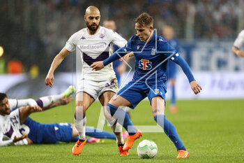 2023-04-13 - Sofyan Amrabat of Fiorentina Michal Skoras of Lech during the UEFA Europa Conference League, Quarter-finals, 1st leg football match between KKS Lech Poznan and ACF Fiorentina on April 13, 2023 at INEA Stadion in Poznan, Poland - FOOTBALL - CONFERENCE LEAGUE - LECH POZNAN V FIORENTINA - UEFA CONFERENCE LEAGUE - SOCCER