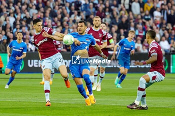 2023-05-12 - Nayef Aguerd of West Ham United tussles with Evangelos Pavlidis (9) of AZ Alkmaar during the UEFA Europa Conference League, Semi-finals, 1st leg football match between West Ham United and AZ Alkmaar on 11 May 2023 at the London Stadium in London, England - FOOTBALL - CONFERENCE LEAGUE - WEST HAM V AZ ALKMAAR - UEFA CONFERENCE LEAGUE - SOCCER