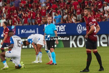 2023-08-24 - Pamplona, Spain. 24th Aug 2023. Sports. Football/Soccer.Raphael Onyedika (15. Club Brugge ), Benoit Millot (match referee) and David Garcia (5. CA Osasuna) during the football match of First leg of the UEFA Europa Conference League qualifier play-off between CA Osasuna and Club Brugge played at El Sadar stadium in Pamplona (Spain) on August 24, 2023. Credit: Inigo Alzugaray/CordonPress - UEFA EUROPA CONFERENCE LEAGUE: CA OSASUNA VS CLUB BRUGGE, PAMPLONA, SPAIN - UEFA CONFERENCE LEAGUE - SOCCER