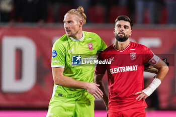 2023-08-31 - Goalkeeper Lars Unnerstall and Robin Propper of FC Twente look dejected after defeat during the UEFA Europa Conference League, Play-offs, 2nd leg football match between FC Twente and Fenerbahce on August 31, 2023 at De Grolsch Veste in Enschede, Netherlands - FOOTBALL - CONFERENCE LEAGUE - TWENTE V FENERBAHCE - UEFA CONFERENCE LEAGUE - SOCCER