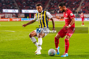2023-08-31 - Joshua King of Fenerbahce battles for possession with Naci Unuvar of FC Twente during the UEFA Europa Conference League, Play-offs, 2nd leg football match between FC Twente and Fenerbahce on August 31, 2023 at De Grolsch Veste in Enschede, Netherlands - FOOTBALL - CONFERENCE LEAGUE - TWENTE V FENERBAHCE - UEFA CONFERENCE LEAGUE - SOCCER