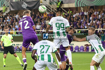 2023-10-05 - Arthur Melo of the ACF Fiorentina and Mohammed Abu Fani of the Ferencvarosi TC ,battle for the ball during the Conference League match between ACF Fiorentina and Ferencvarosi TC at Stadio Artemio Franchi on October 5, 2023 in Florence, Italy - ACF FIORENTINA VS FERENCVAROSI TC - UEFA CONFERENCE LEAGUE - SOCCER
