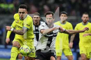 2023-01-10 - Lautaro Martinez of FC Internazionale competes for the ball with Franco Vazquez of Parma Calcio during Coppa Italia 2022/23 football match between FC Internazionale and Parma Calcio at Giuseppe Meazza Stadium, Milan, Italy on January 10, 2023 - INTER - FC INTERNAZIONALE VS PARMA CALCIO - ITALIAN CUP - SOCCER