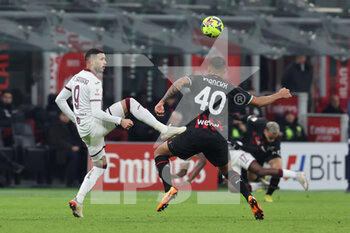 2023-01-11 - Antonio Sanabria of Torino FC competes for the ball with Aster Vranckx of AC Milan during Coppa Italia 2022/23 football match between AC Milan and Torino FC at San Siro Stadium, Milan, Italy on January 11, 2023 - AC MILAN VS TORINO FC - ITALIAN CUP - SOCCER