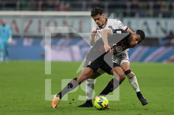 2023-01-11 - Aster Vranckx of AC Milan competes for the ball with Samuele Ricci of Torino FC during Coppa Italia 2022/23 football match between AC Milan and Torino FC at San Siro Stadium, Milan, Italy on January 11, 2023 - AC MILAN VS TORINO FC - ITALIAN CUP - SOCCER