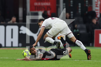 2023-01-11 - Aster Vranckx of AC Milan competes for the ball with Samuele Ricci of Torino FC during Coppa Italia 2022/23 football match between AC Milan and Torino FC at San Siro Stadium, Milan, Italy on January 11, 2023 - AC MILAN VS TORINO FC - ITALIAN CUP - SOCCER