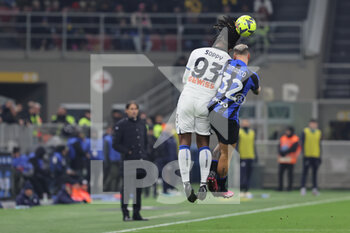 2023-01-31 - Federico Dimarco of FC Internazionale competes for the ball with Brandon Soppy of Atalanta BC during Coppa Italia 2022/23 football match between FC Internazionale and Atalanta BC at Giuseppe Meazza Stadium, Milan, Italy on January 31, 2023 - INTER - FC INTERNAZIONALE VS ATALANTA BC - ITALIAN CUP - SOCCER