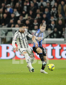 2023-04-04 - Nicolo Barella of FC Internazionale and Filip Kostic of Juventus during the Coppa Italia, semifinal first leg,  football match between Juventus Fc and Fc Internazionale, on 04 April 2023 at Allianz Stadium, Turin, Italy. Photo Nderim Kaceli - SEMIFINAL - JUVENTUS FC VS INTER - FC INTERNAZIONALE - ITALIAN CUP - SOCCER