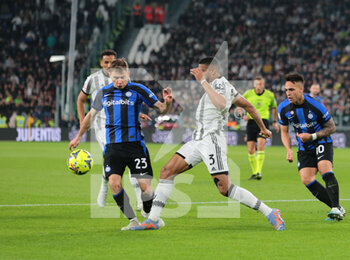 2023-04-04 - Nicolo Barella of FC Internazionale and Bremer of Juventus during the Coppa Italia, semifinal first leg,  football match between Juventus Fc and Fc Internazionale, on 04 April 2023 at Allianz Stadium, Turin, Italy. Photo Nderim Kaceli - SEMIFINAL - JUVENTUS FC VS INTER - FC INTERNAZIONALE - ITALIAN CUP - SOCCER