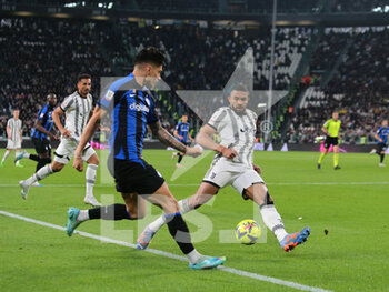 2023-04-04 - Joaquin Correa of FC Internazionale and Bremer of Juventus during the Coppa Italia, semifinal first leg,  football match between Juventus Fc and Fc Internazionale, on 04 April 2023 at Allianz Stadium, Turin, Italy. Photo Nderim Kaceli - SEMIFINAL - JUVENTUS FC VS INTER - FC INTERNAZIONALE - ITALIAN CUP - SOCCER
