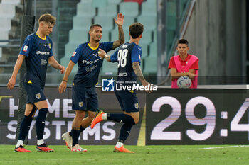 2023-08-12 - Dennis Man (Parma Calcio) celebrates after scoring a goal with Anthony Partipilo (Parma Calcio) - SSC BARI VS PARMA CALCIO - ITALIAN CUP - SOCCER