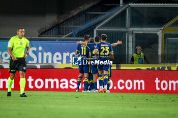 2023-08-12 - Verona's Jordi Mboula celebrates after scoring a goal with teammates - HELLAS VERONA FC VS ASCOLI CALCIO - ITALIAN CUP - SOCCER