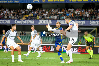 2023-08-12 - Ascoli's Eric Botteghin hindered by Verona's Jordi Mboula - HELLAS VERONA FC VS ASCOLI CALCIO - ITALIAN CUP - SOCCER