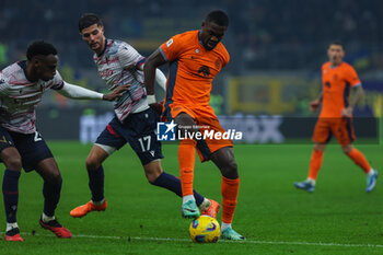 2023-12-20 - Marcus Thuram of FC Internazionale seen in action during Coppa Italia 2023/24 Round of 16 football match between FC Internazionale and Bologna FC at Giuseppe Meazza Stadium, Milan, Italy on December 20, 2023 - INTER - FC INTERNAZIONALE VS BOLOGNA FC - ITALIAN CUP - SOCCER