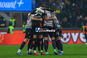 2023-12-20 - Bologna FC players celebrate the victory at the end of the match during Coppa Italia 2023/24 Round of 16 football match between FC Internazionale and Bologna FC at Giuseppe Meazza Stadium, Milan, Italy on December 21, 2023 - INTER - FC INTERNAZIONALE VS BOLOGNA FC - ITALIAN CUP - SOCCER