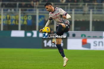 2023-12-20 - Charalampos Lykogiannis of Bologna FC seen in action during Coppa Italia 2023/24 Round of 16 football match between FC Internazionale and Bologna FC at Giuseppe Meazza Stadium, Milan, Italy on December 21, 2023 - INTER - FC INTERNAZIONALE VS BOLOGNA FC - ITALIAN CUP - SOCCER