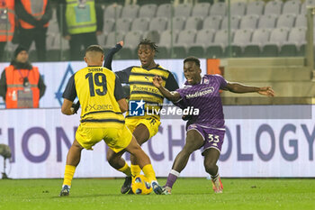 2023-12-06 - Michael Kayode of ACF Fiorentina and Woyo Coulibaly of Parma Calcio 1913 ,battle for the ball during the Coppa Italia Frecciarossa, football match between ACF Fiorentina and Parma Calcio 1913 on Dicember 6, 2023 at the Stadio Artemio Franchi in Florence - ACF FIORENTINA VS PARMA CALCIO - ITALIAN CUP - SOCCER