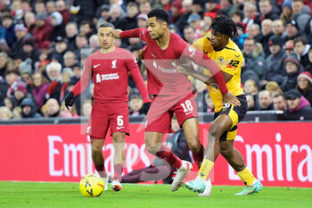 2023-01-07 - Liverpool forward Cody Gakpo (18) holds off Wolverhampton Wanderers Dexter Lembikisa (81) during the English FA Cup, 3rd round football match between Liverpool and Wolverhampton Wanderers on January 7, 2023 at Anfield stadium in Liverpool, England - FOOTBALL - ENGLISH CUP - LIVERPOOL V WOLVERHAMPTON - ENGLISH LEAGUE CUP - SOCCER
