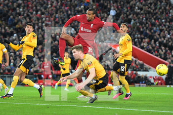 2023-01-07 - Liverpool defender Joel Matip (32) challenges for Wolverhampton Wanderers defender Nathan Collins (4) during the English FA Cup, 3rd round football match between Liverpool and Wolverhampton Wanderers on January 7, 2023 at Anfield stadium in Liverpool, England - FOOTBALL - ENGLISH CUP - LIVERPOOL V WOLVERHAMPTON - ENGLISH LEAGUE CUP - SOCCER
