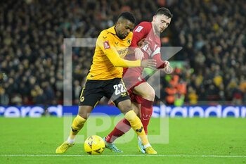 2023-01-07 - Liverpool defender Andrew Robertson (26) and Wolverhampton Wanderers defender Nelson Semedo (22) tussle for the ball during the English FA Cup, 3rd round football match between Liverpool and Wolverhampton Wanderers on January 7, 2023 at Anfield stadium in Liverpool, England - FOOTBALL - ENGLISH CUP - LIVERPOOL V WOLVERHAMPTON - ENGLISH LEAGUE CUP - SOCCER
