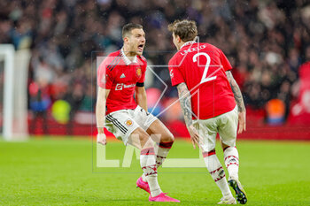 2023-04-24 - Diogo Dalot (20) of Manchester United celebrates with Victor Lindelof (2) of Manchester United after winning on penalties during the English championship, FA Cup semi final football match between Brighton and Hove Albion and Manchester United on 23 April 2023 at Wembley Stadium in London, England - FOOTBALL - ENGLISH CUP - BRIGHTON V MANCHESTER UNITED - ENGLISH LEAGUE CUP - SOCCER