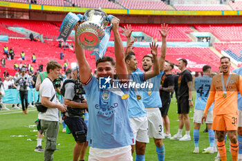 2023-06-04 - Julian Alvarez (19) of Manchester City celebrates with the FA Cup at full time during the English FA Cup, Final football match between Manchester City and Manchester United on 3 June 2023 at Wembley Stadium in London, England - FOOTBALL - ENGLISH CUP - FINAL - MANCHESTER CITY V MANCHESTER UNITED - ENGLISH LEAGUE CUP - SOCCER