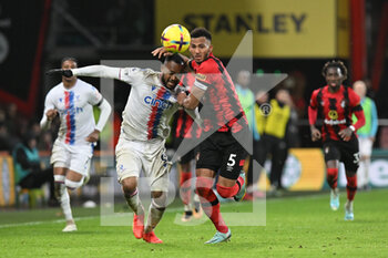 2023-01-01 - Lloyd Kelly (5) of AFC Bournemouth battles for possession with Jordan Ayew (9) of Crystal Palace during the English championship Premier League football match between Bournemouth and Crystal Palace on 31 December 2022 at the Vitality Stadium in Bournemouth, England - FOOTBALL - ENGLISH CHAMP - BOURNEMOUTH V CRYSTAL PALACE - ENGLISH PREMIER LEAGUE - SOCCER
