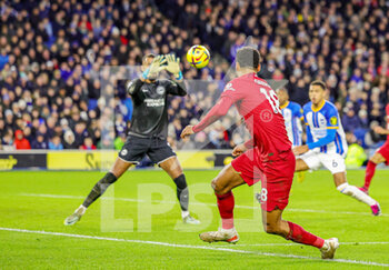 2023-01-14 - Cody Gakpo (18) of Liverpool shoots towards the goal during the English championship Premier League football match between Brighton and Hove Albion and Liverpool on January 14, 2023 at the American Express Community Stadium in Brighton and Hove, England - FOOTBALL - ENGLISH CHAMP - BRIGHTON V LIVERPOOL - ENGLISH PREMIER LEAGUE - SOCCER
