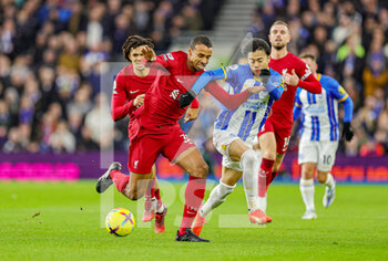 2023-01-14 - Joel Matip (32) of Liverpool battles with Kaoru Mitoma (22) of Brighton & Hove Albion during the English championship Premier League football match between Brighton and Hove Albion and Liverpool on January 14, 2023 at the American Express Community Stadium in Brighton and Hove, England - FOOTBALL - ENGLISH CHAMP - BRIGHTON V LIVERPOOL - ENGLISH PREMIER LEAGUE - SOCCER