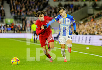 2023-01-14 - Kaoru Mitoma (22) of Brighton & Hove Albion tussles with Trent Alexander-Arnold (66) of Liverpool during the English championship Premier League football match between Brighton and Hove Albion and Liverpool on January 14, 2023 at the American Express Community Stadium in Brighton and Hove, England - FOOTBALL - ENGLISH CHAMP - BRIGHTON V LIVERPOOL - ENGLISH PREMIER LEAGUE - SOCCER