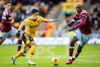 2023-01-14 - Wolverhampton Wanderers forward Hwang Hee-Chan and Angelo Ogbonna of West Ham during the English championship Premier League football match between Wolverhampton Wanderers and West Ham United on January 14, 2023 at Molineux stadium in Wolverhampton, England - FOOTBALL - ENGLISH CHAMP - WOLVERHAMPTON V WEST HAM - ENGLISH PREMIER LEAGUE - SOCCER