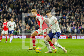 2023-01-16 - Clément Lenglet (34) of Tottenham Hotspur tussles with Martin Odegaard (8) of Arsenal during the Premier League match between Tottenham Hotspur and Arsenal at Tottenham Hotspur Stadium, London, United Kingdom on 15 January 2023. Photo Nigel Keene/ProSportsImages / DPPI - FOOTBALL - ENGLISH CHAMP - TOTTENHAM V ARSENAL - ENGLISH PREMIER LEAGUE - SOCCER