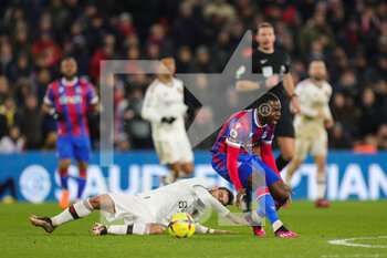 2023-01-19 - Crystal Palace Tyrick Mitchel fouled by Manchester United midfielder Bruno Fernandes during the English championship Premier League football match between Crystal Palace and Manchester United on January 18, 2023 at Selhurst Park in London, England - FOOTBALL - ENGLISH CHAMP - CRYSTAL PALACE V MANCHESTER UNITED - ENGLISH PREMIER LEAGUE - SOCCER
