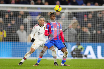 2023-01-19 - Crystal Palace (11) Wilfried Zaha, Manchester United midfielder Casemiro (18) during the English championship Premier League football match between Crystal Palace and Manchester United on January 18, 2023 at Selhurst Park in London, England - FOOTBALL - ENGLISH CHAMP - CRYSTAL PALACE V MANCHESTER UNITED - ENGLISH PREMIER LEAGUE - SOCCER
