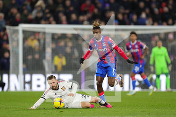 2023-01-19 - Crystal Palace (11) Wilfried Zaha and Manchester United defender Luke Shaw (23) during the English championship Premier League football match between Crystal Palace and Manchester United on January 18, 2023 at Selhurst Park in London, England - FOOTBALL - ENGLISH CHAMP - CRYSTAL PALACE V MANCHESTER UNITED - ENGLISH PREMIER LEAGUE - SOCCER