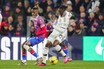2023-01-19 - Manchester United defender Aaron Wan-Bissaka (29) and Crystal Palace Wilfried Zaha during the English championship Premier League football match between Crystal Palace and Manchester United on January 18, 2023 at Selhurst Park in London, England - FOOTBALL - ENGLISH CHAMP - CRYSTAL PALACE V MANCHESTER UNITED - ENGLISH PREMIER LEAGUE - SOCCER