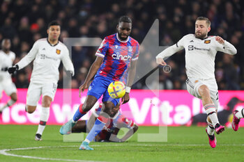 2023-01-19 - Crystal Palace (22) Odsonne Edouard and Manchester United defender Luke Shaw (23) during the English championship Premier League football match between Crystal Palace and Manchester United on January 18, 2023 at Selhurst Park in London, England - FOOTBALL - ENGLISH CHAMP - CRYSTAL PALACE V MANCHESTER UNITED - ENGLISH PREMIER LEAGUE - SOCCER