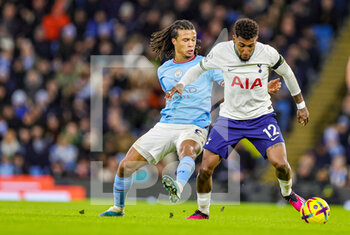 2023-01-20 - Emerson (12) of Tottenham Hotspur battles with Nathan Ake (6) of Manchester City during the English championship Premier League football match between Manchester City and Tottenham Hotspur on January 19, 2023 at the Etihad Stadium in Manchester, England - FOOTBALL - ENGLISH CHAMP - MANCHESTER CITY V TOTTENHAM - ENGLISH PREMIER LEAGUE - SOCCER