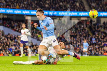 2023-01-20 - Cristian Romero (17) of Tottenham Hotspur tackles Jack Grealish (10) of Manchester City during the English championship Premier League football match between Manchester City and Tottenham Hotspur on January 19, 2023 at the Etihad Stadium in Manchester, England - FOOTBALL - ENGLISH CHAMP - MANCHESTER CITY V TOTTENHAM - ENGLISH PREMIER LEAGUE - SOCCER