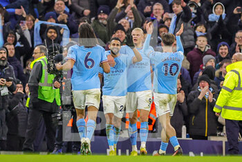 2023-01-20 - Riyad Mahrez (26) of Manchester City celebrates his goal 4-2 with teammates during the English championship Premier League football match between Manchester City and Tottenham Hotspur on January 19, 2023 at the Etihad Stadium in Manchester, England - FOOTBALL - ENGLISH CHAMP - MANCHESTER CITY V TOTTENHAM - ENGLISH PREMIER LEAGUE - SOCCER