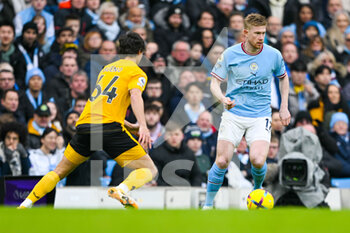 2023-01-22 - Manchester City midfielder Kevin De Bruyne (17) and Wolverhampton Wanderers defender Hugo Bueno during the English championship Premier League football match between Manchester City and Wolverhampton Wanderers on January 22, 2023 at the Etihad Stadium in Manchester, England - FOOTBALL - ENGLISH CHAMP - MANCHESTER CITY V WOLVERHAMPTON - ENGLISH PREMIER LEAGUE - SOCCER