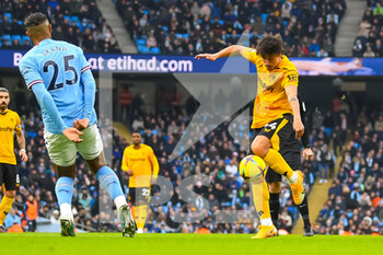 2023-01-22 - Wolverhampton Wanderers defender Hugo Bueno and Manuel Akanji of Manchester City during the English championship Premier League football match between Manchester City and Wolverhampton Wanderers on January 22, 2023 at the Etihad Stadium in Manchester, England - FOOTBALL - ENGLISH CHAMP - MANCHESTER CITY V WOLVERHAMPTON - ENGLISH PREMIER LEAGUE - SOCCER