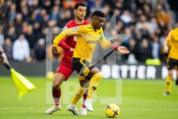 2023-02-04 - Wolverhampton Wanderers defender Nelson Semedo (22) and Liverpool forward Cody Gakpo during the English championship Premier League football match between Wolverhampton Wanderers and Liverpool on February 4, 2023 at Molineux stadium in Wolverhampton, England - FOOTBALL - ENGLISH CHAMP - WOLVERHAMPTON V LIVERPOOL - ENGLISH PREMIER LEAGUE - SOCCER