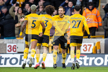 2023-02-04 - Wolverhampton Wanderers defender Craig Dawson (15) scores and celebrates with team mates 2-0 during the English championship Premier League football match between Wolverhampton Wanderers and Liverpool on February 4, 2023 at Molineux stadium in Wolverhampton, England - FOOTBALL - ENGLISH CHAMP - WOLVERHAMPTON V LIVERPOOL - ENGLISH PREMIER LEAGUE - SOCCER