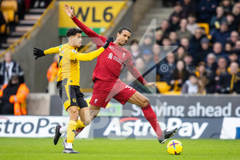 2023-02-04 - Wolverhampton Wanderers midfielder Matheus Nunes (27) and Liverpool defender Joel Matip (32) during the English championship Premier League football match between Wolverhampton Wanderers and Liverpool on February 4, 2023 at Molineux stadium in Wolverhampton, England - FOOTBALL - ENGLISH CHAMP - WOLVERHAMPTON V LIVERPOOL - ENGLISH PREMIER LEAGUE - SOCCER