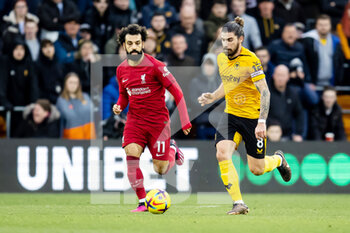 2023-02-04 - Wolverhampton Wanderers midfielder Ruben Neves (8) and Liverpool forward Mohamed Salah during the English championship Premier League football match between Wolverhampton Wanderers and Liverpool on February 4, 2023 at Molineux stadium in Wolverhampton, England - FOOTBALL - ENGLISH CHAMP - WOLVERHAMPTON V LIVERPOOL - ENGLISH PREMIER LEAGUE - SOCCER