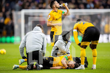 2023-02-04 - Wolverhampton Wanderers forward Hwang Hee-Chan (11) injured during the English championship Premier League football match between Wolverhampton Wanderers and Liverpool on February 4, 2023 at Molineux stadium in Wolverhampton, England - FOOTBALL - ENGLISH CHAMP - WOLVERHAMPTON V LIVERPOOL - ENGLISH PREMIER LEAGUE - SOCCER